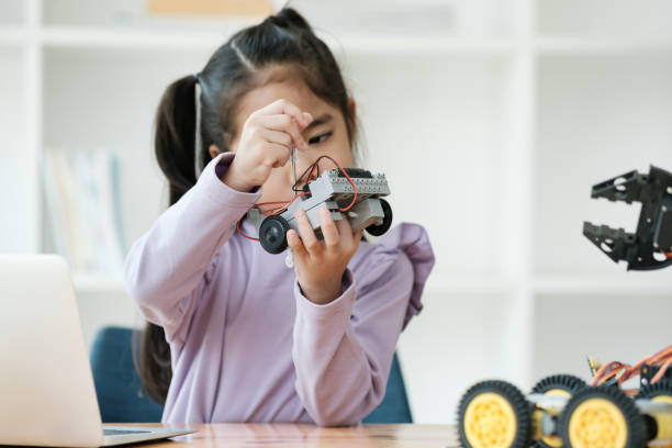 istock STEM education concept. Asian young girl learning robot design. 2046727128