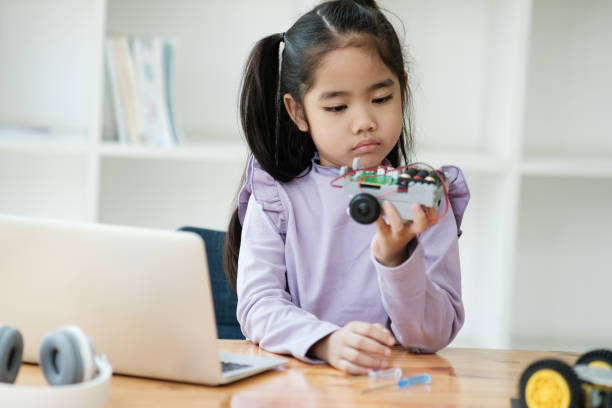 istock STEM education concept. Asian young girl learning robot design. 2046727431