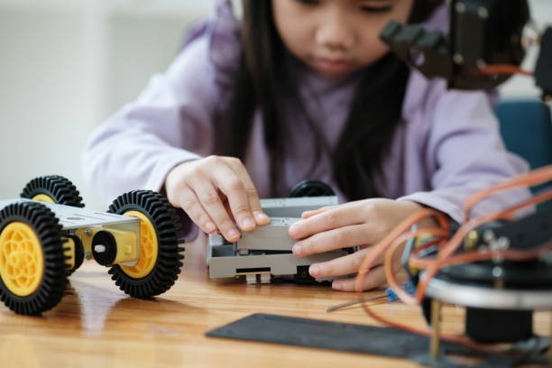 istock STEM education concept. Asian young girl learning robot design. 2046727570