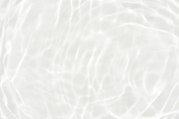 istock White water surface texture with ripples, splashes, and bubbles. Abstract summer banner background Water waves in sunlight with copy space cosmetic moisturizer micellar toner emulsion. White water. 2046750127