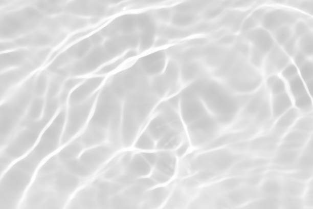 istock White water surface texture with ripples, splashes, and bubbles. Abstract summer banner background Water waves in sunlight with copy space cosmetic moisturizer micellar toner emulsion. White water. 2046750253