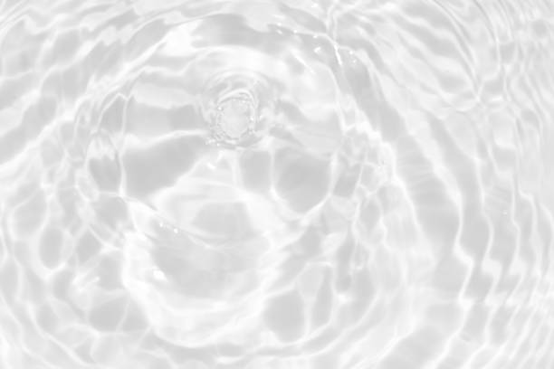 istock White water surface texture with ripples, splashes, and bubbles. Abstract summer banner background Water waves in sunlight with copy space cosmetic moisturizer micellar toner emulsion. White water. 2046750823