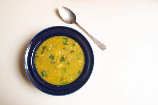 Delicious  soup with green lentils ready to eat for lunch at home .