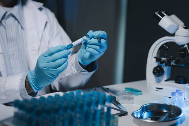 istock Many test tubes were analyzed by experts, A researcher is carefully studying the liquid contained in a test tube because it is an important area of research. 2046770987