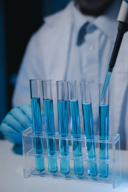 istock Many test tubes were analyzed by experts, A researcher is carefully studying the liquid contained in a test tube because it is an important area of research. 2046774717