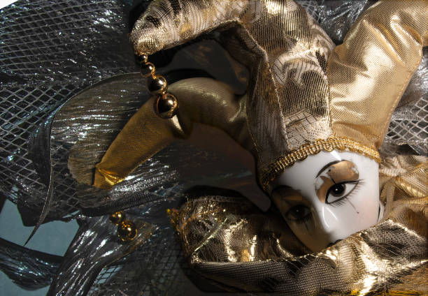 1st of March. 2025. Venice. Italy.\n\nPortrait of female person posing at the San Marco Square in her fancy harlequin dress.  The Venice carnival is an annual event -  visited by many many people.