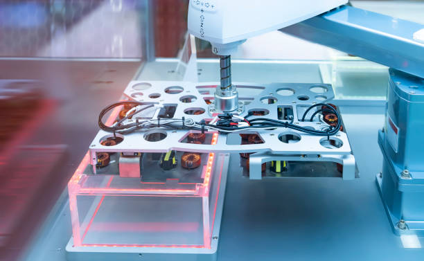 artificial intelligence machine at industrial manufacture factory for toroidal coils with magnetic ferrite core wrapped in copper wire on electronic components pile
