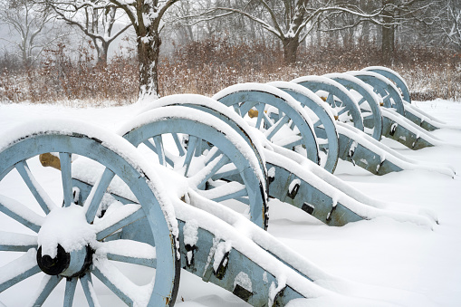 Cannons covered with snow at Artillery Park in Valley Forge National Historic Park, King of Prussia, Pennsylvania, USA