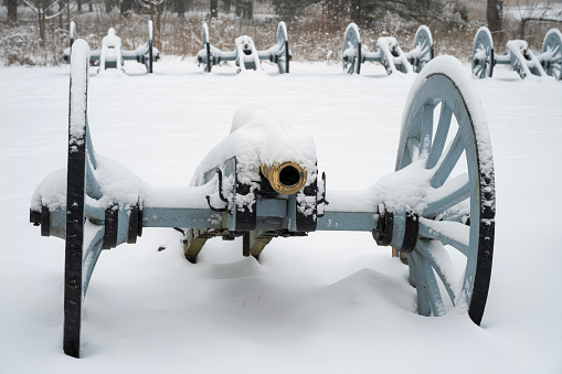 Cannons covered with snow at Artillery Park in Valley Forge National Historic Park, King of Prussia, Pennsylvania, USA