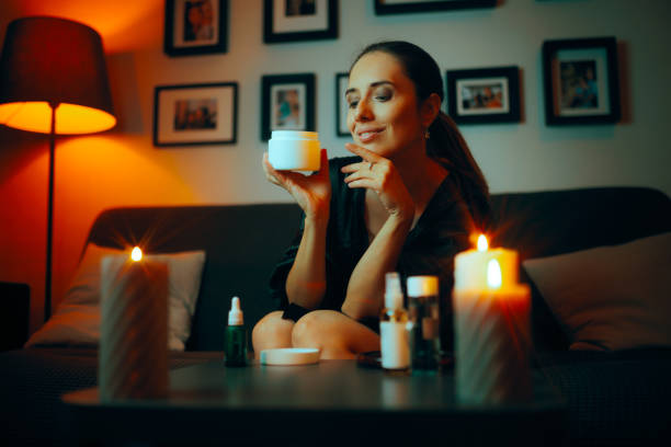 istock Happy Woman Using a Face Cream in her Beauty Routine at Home 2046842577