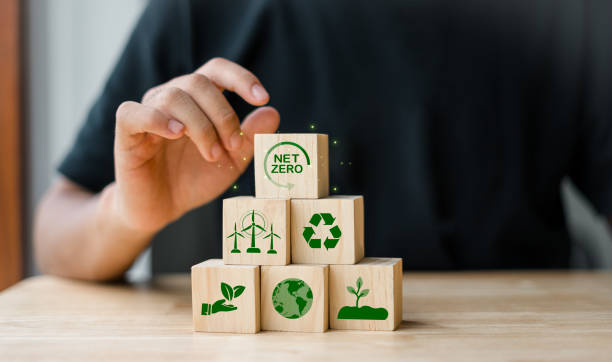 istock NET ZERO Zero carbon or greenhouse gas emissions, return clean air to the world, a long-term strategy that is climate neutral and develops towards a green environment and sustainable business. 2046869681