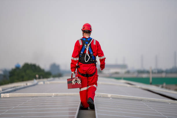 istock Engineers walking on roof inspect and check solar cell panel by hold equipment box and radio communication ,solar cell is smart grid ecology energy sunlight alternative power factory concept. 2046873078