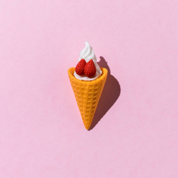 istock A cup of fresh ice cream with strawberries on a pink background. 2046873403