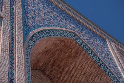 JUNE 26, 2023, TASHKENT, UZBEKISTAN: Kukeldash Madrasah, medieval madrasa in Tashkent, Uzbekistan. Blue sky with copy space for text