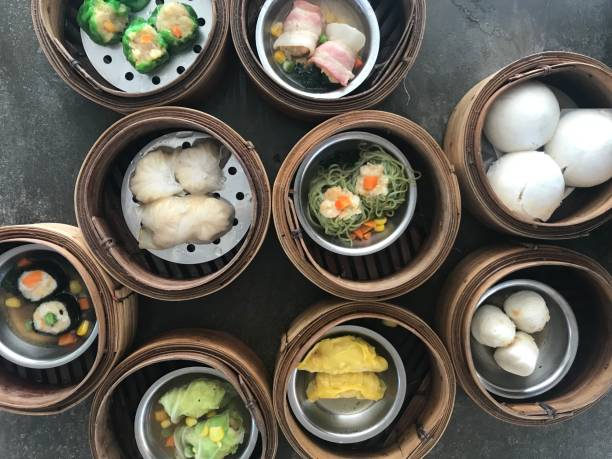 istock chinese style steamed dim sum dishes in bamboo baskets 2046941377