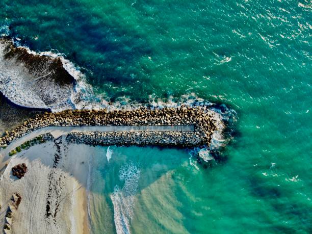 istock Waves Crashing against Cottesloe Jetty, Perth Australia 2046952049