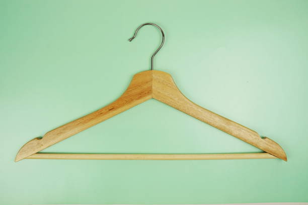 istock Wooden hanger top view on green background 2047028566