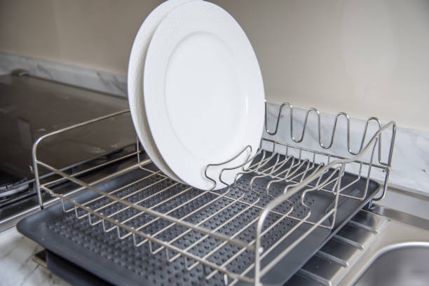 istock Kitchen basin with room for drying dishes, displaying shiny silver chrome taps and pipes. 2047041921