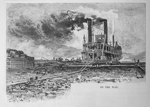 Illustration from Harper's Magazine Volume LXIV December 1881 to May 1882: A new paddle wheel steamship rolls down a bed of logs  as she is being launched into the Mississippi, Ohio or Missouri Rivers to transport coal to New Orleans.