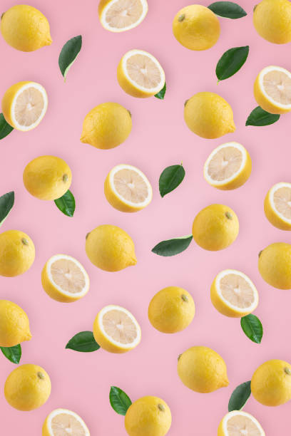 istock Fresh Yellow Lemon for a healthy and decorative design on a pink background 2047063071