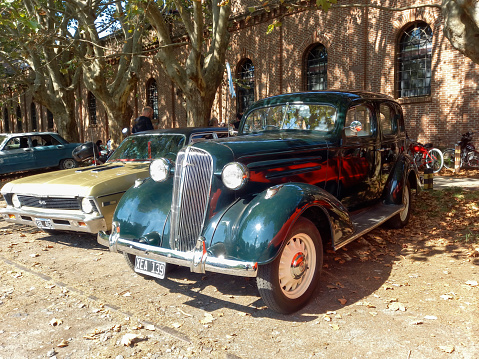 Remedios de Escalada, Argentina - Feb 11, 2024: Old green 1936 Chevrolet Master sedan at a classic car show in a park on a sunny day. Copy space
