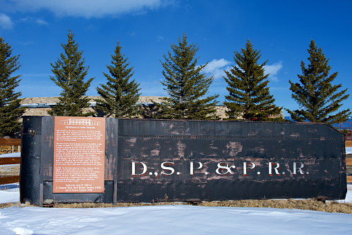 Como, Colorado, USA - February 12, 2024: A sign informs visitors about the Como Roundhouse and the narrow gauge railroad junction in this historic South Park town.