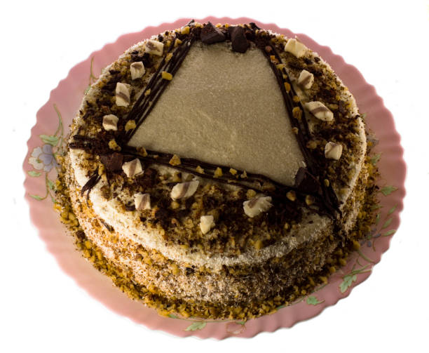 istock Brown mousse cake on a plate on a white background 2047141979