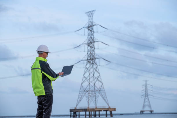 istock Engineer surveyor team under used drone camera for operator inspecting and survey construction site with gas oil refinery background 2047153313