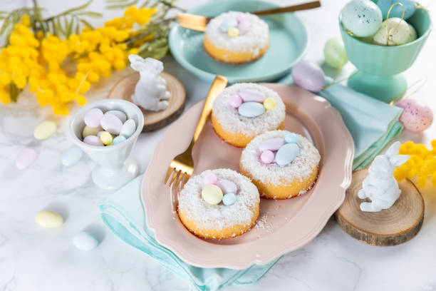 istock Baked donut with coconut flakes and mini candy eggs for easter 2047186334