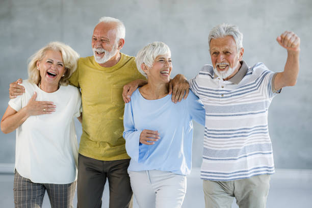 istock Cheerful senior couples having fun together. 2047275984