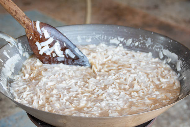 thin coconut flakes fried in sugar syrup , sweet orange and yellow coconut flakes fried in sugar