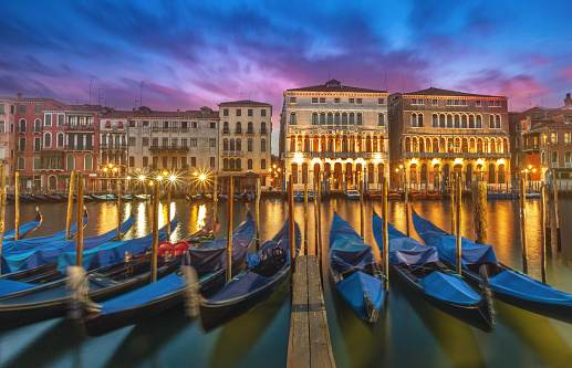 Docked gondolas along the Grand Canal in Venice