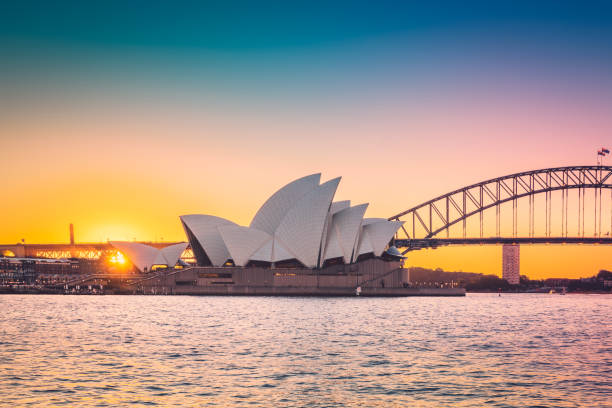 Sydney, Australia - April 20, 2022: Stunning view of Sydney Opera House with colourful evening sky hues at sunset time