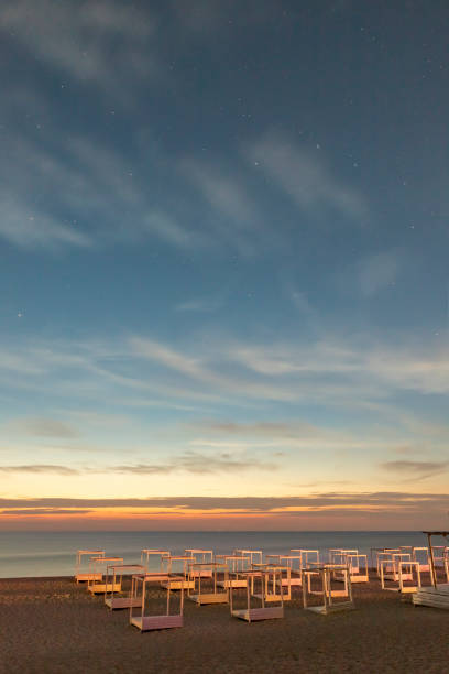 Sunset on the beach in the evening with stars in the sky