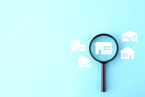 istock Magnifying glass and various house pictograms 2047375760