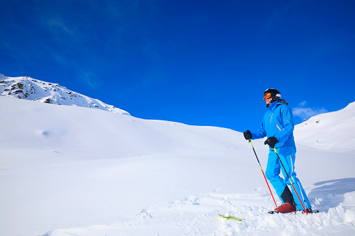 Skiing winter sport.  Vital senior men, Happy snow skier, enjoying on sunny ski resorts.  Snowcapped mountain  Ski resort Val Gardena,  Dolomiti superski, Sellaronda,  italy, Europe.