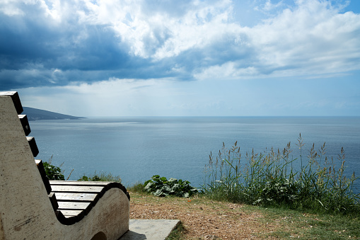 A bench on the observation deck above the sea. Panorama