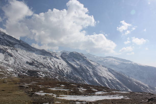 istock snow covered with mountains on the rocks and sand 2047437834