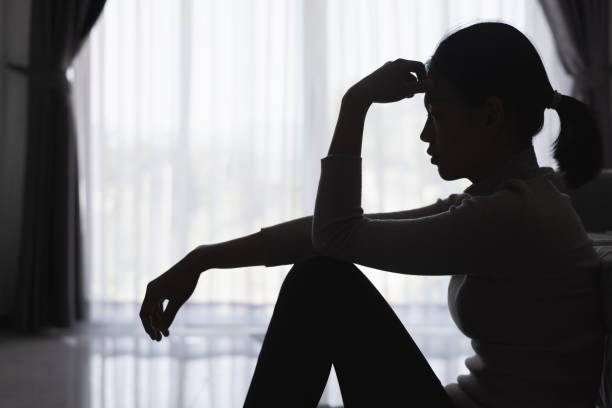 istock Silhouette of a sad woman in violent problems. Mental problems. Life problems. Dark domestic violence. Stress. Violence. Depression and suicide concept. 2047438869