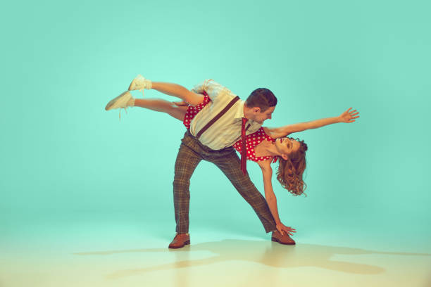 holding two ballet dancing partner