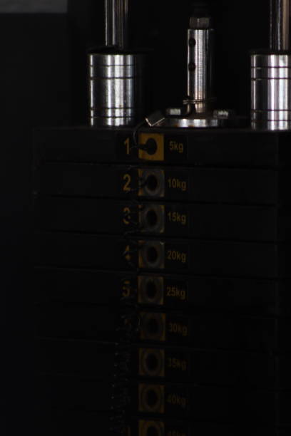 Captured this modern gym equipment during work out in the gym. Weight lifting equipment which helps to increase the biceps and maintain good physique. Build strength and improve muscles with weight lifting equipment.