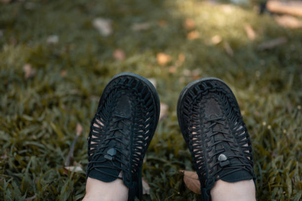 black adult men's slippers, taken from the front position