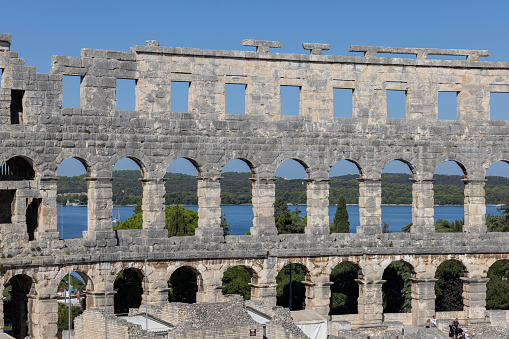 Roman temple of Augustus with Corinthian columns, well preserved ancient architecture on a city square, in Pula, Croatia