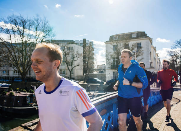 group of young runners in central london preparing for the marathon - marathon running london england competition ストックフォトと画像