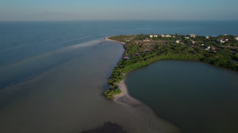 Aerial panning view of Bioluminiscencia in Holbox in Mexico on a clear evening.