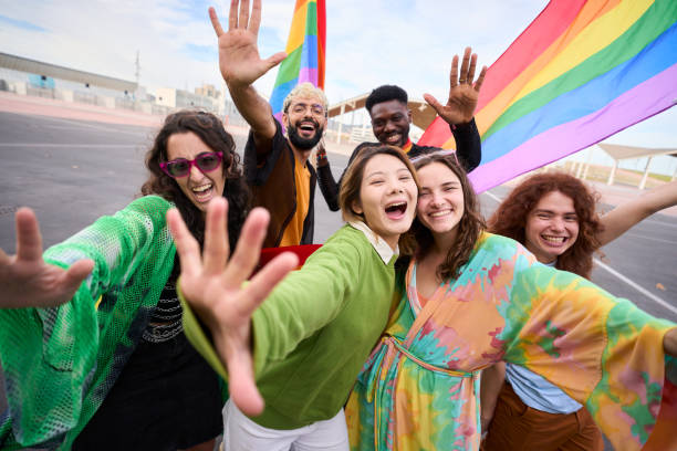 istock Group of people are taking a selfie with a rainbow flag 2047506551
