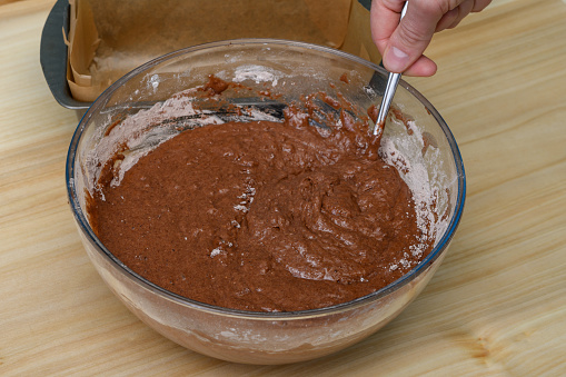 Mix the chocolate dough and transfer it to the prepared baking tray lined with baking paper