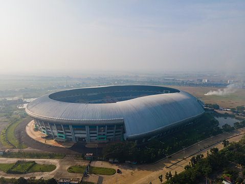 Aerial view of Gelora Bandung Lautan Api (GBLA) Stadium in the morning, the biggest football stadium in West Java, Indonesia, located in Bandung City.