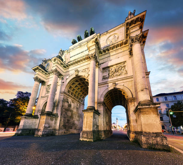 istock Dramatic sunset over Siegestor - Victory Gate  arch in downtown Munich, Germany 2047573417