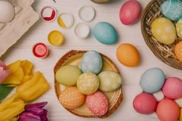istock Easter egg painting at the kitchen table.Happy Easter celebration concept.Colorful Easter eggs with different patterns.Paints,decorations for coloring eggs for holiday.Creative background.Copy space 2047582343